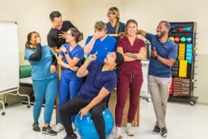 The group of physical therapists at Medical Hill doing a funny photo