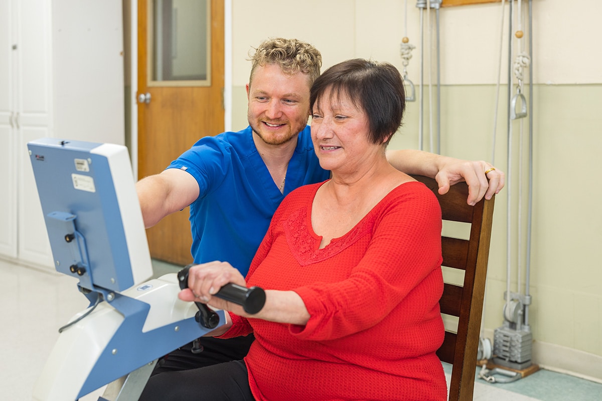 A woman doing therapy with a physical therapist at Medical Hill